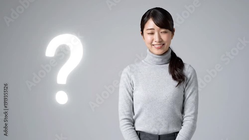 Young woman with question mark, thinking or unsure, isolated on gray background
