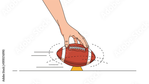 Close up of a human hand spinning a brown American football on a yellow tee with motion lines indicating fast rotational movement.
