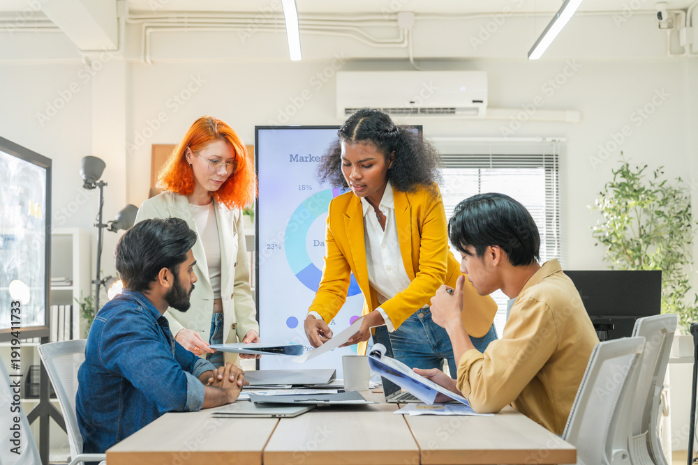 Obraz premium Business team meeting in modern office analyzing data charts, collaborative discussion, professional teamwork, strategy planning, corporate presentation, startup brainstorming success.