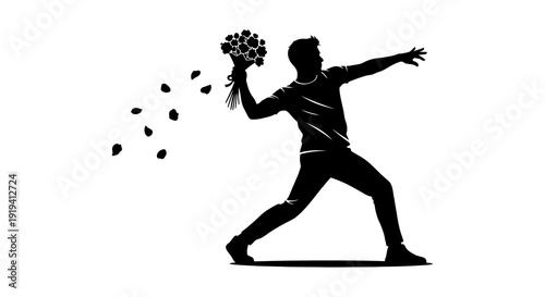 Silhouette of a man throwing flowers petals scattering in the air