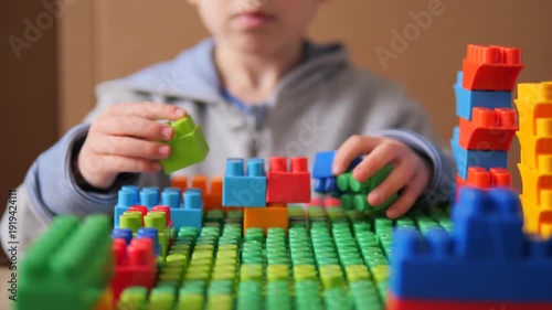Child Hands Building Colorful Block Tower – Creative Play with Toys and School Supplies 4K Close-Up of 