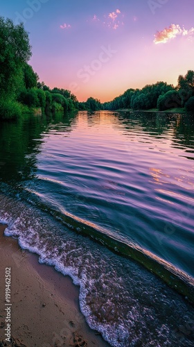 Tranquil river sunset reflecting vibrant colors