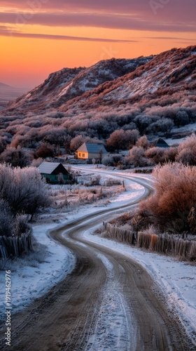 Winding road leads to a cozy house at dusk in winter