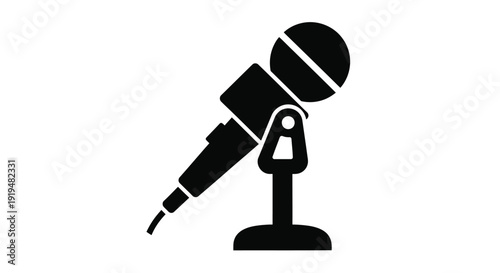 Simple black silhouette of a microphone on a stand isolated on white