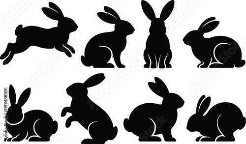 Nine black silhouette rabbits in various poses on a white background 1