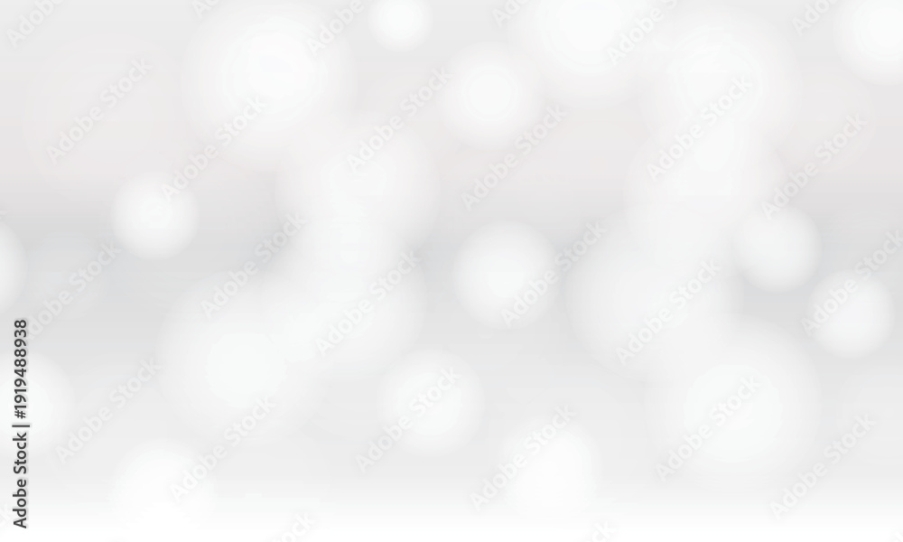 Obraz premium 白い光の玉ボケが広がる抽象的な背景