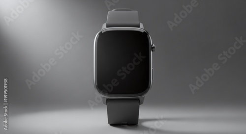 Sleek black smartwatch displayed on a soft gray background with dramatic studio lighting for product showcase.