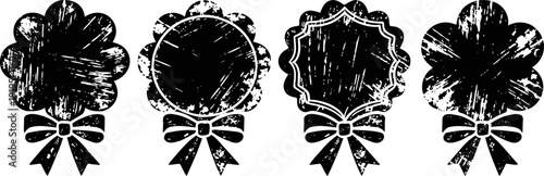 Four vintage black ribbon badges with distressed texture and ornamental shapes