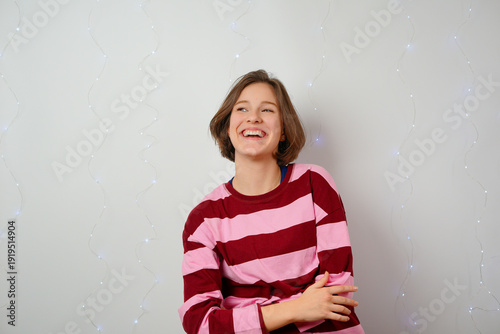 happy young girl smiling gently relieved decision satisfaction content expression joy inner peace emotional wellness positive choice