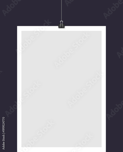 Minimalist blank paper hanging on dark background.