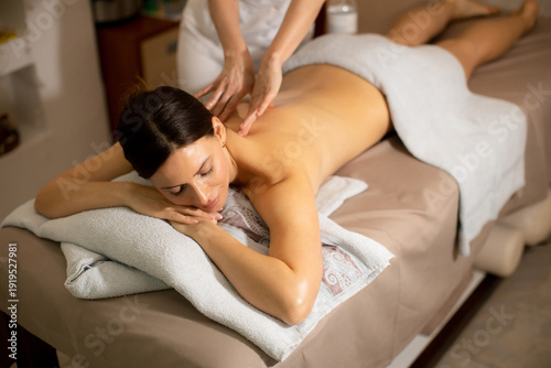 Woman receives a massage in...