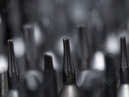 set of metal screws in a row