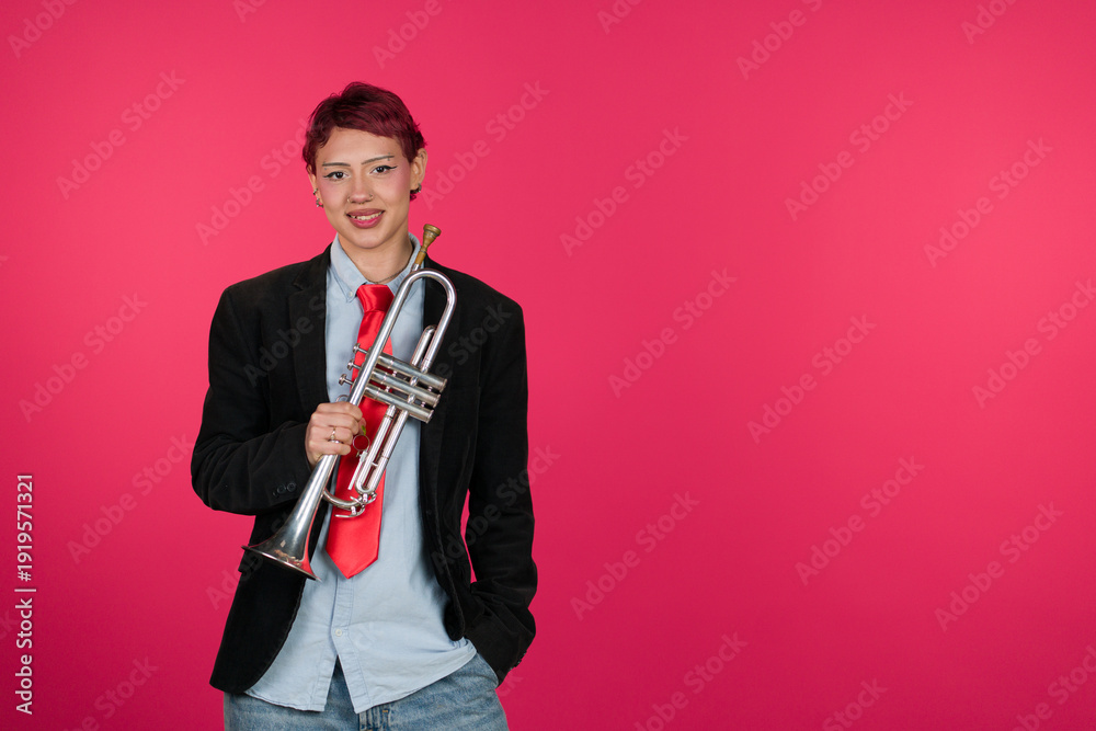 Fototapeta premium Young musician woman holding trumpet smiling at camera