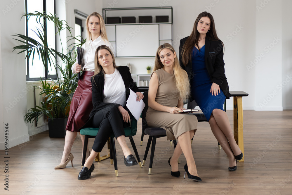 Obraz premium Professional women collaborating, showcasing leadership, teamwork, and empowerment in a contemporary office setting, representing diversity and success in a female driven business environment