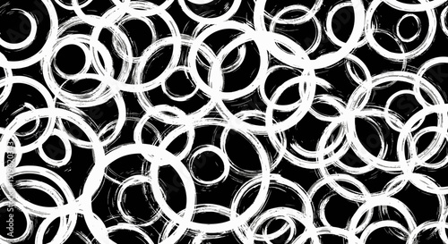 Abstract white circles on black background, artistic design