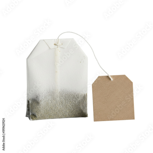 Pristine square green tea teabag with a blank kraft paper tag isolated on a transparent background with copy space. Concept of purity and wellness