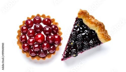 Two fruit tarts, one cherry and one blackberry, on a white surface