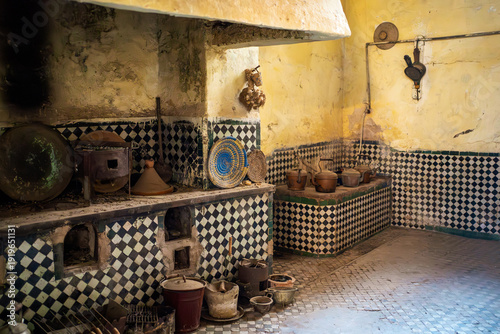 Billede på lærred Ancient Moroccan kitchen with tajine pots and zellij tiles, Palais El Glaoui, Fes