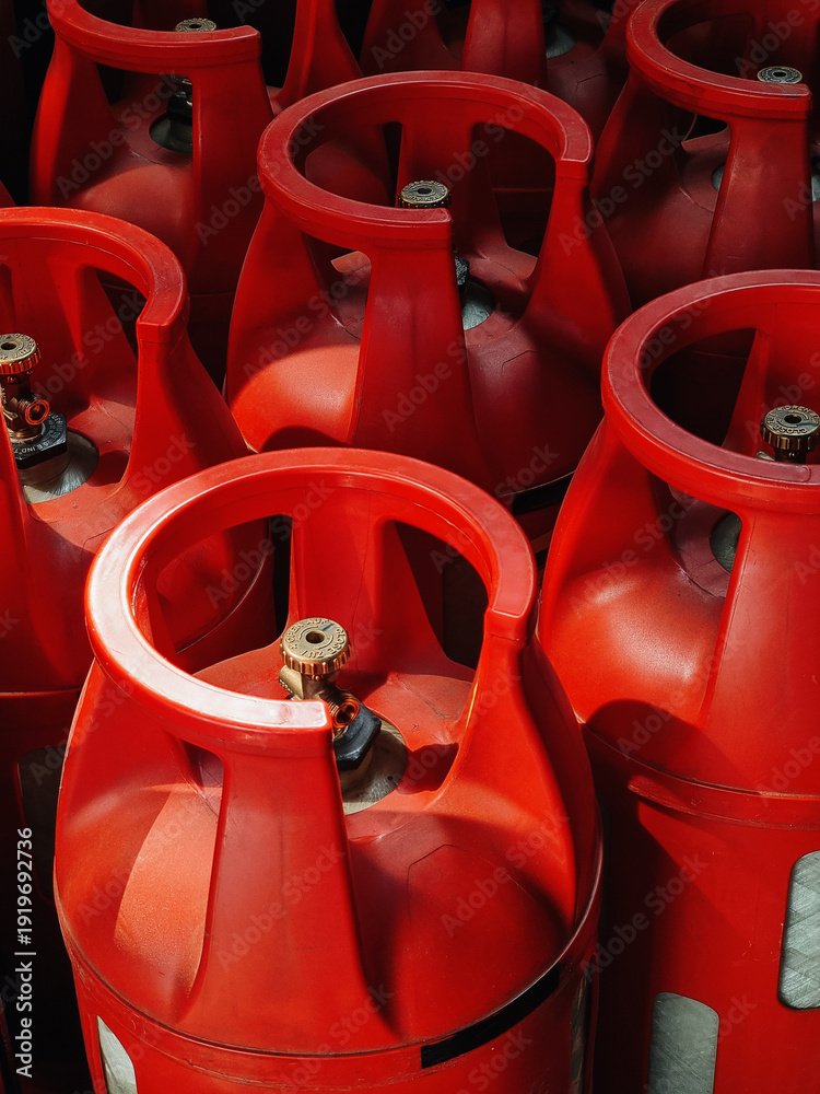 Fotografie Red composite gas tanks with brass valves