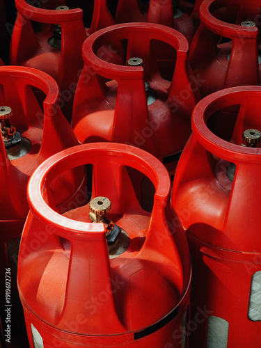 Fotografie Red composite gas tanks with brass valves