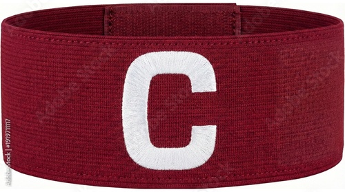 A close-up shot of a red armband with a white 'C' letter, symbolizing leadership and authority