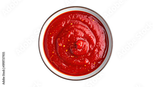 A bowl of vibrant, thick, red sauce, overhead shot
