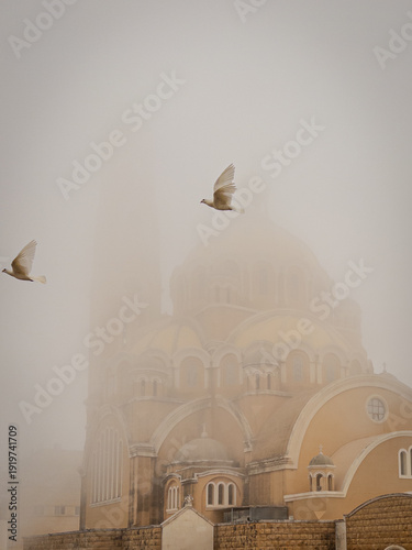 Two White Doves Flying Over Fog-Shrouded Byzantine Basilica Dome, Jounieh Lebanon