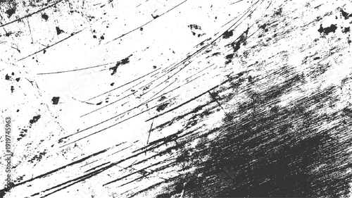 Black ink splatters and scratches on a white textured surface abstract background
