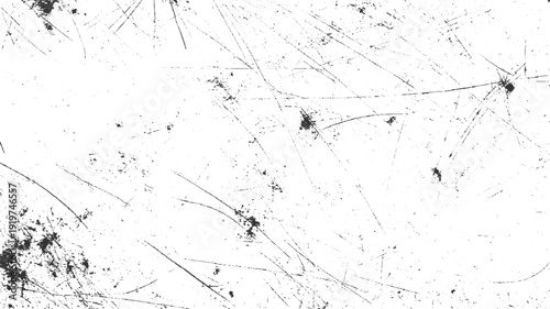 Black scratches and speckles on a white background creating a distressed texture abstract