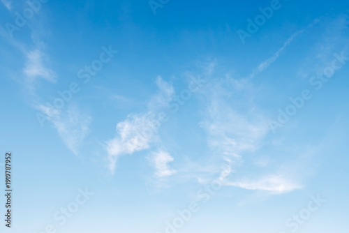 Blue sky and white fluffy tiny clouds background and pattern