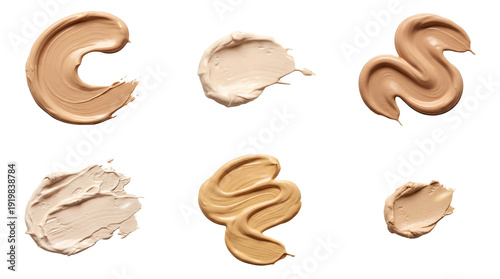Collection of liquid foundation cream strokes and beauty product smears on grey background