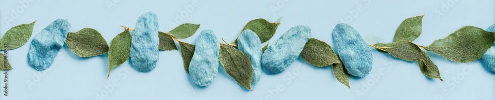 Fototapeta premium Human kidney organs made of paper material and green leaves for World Kidney Day and organ donor awareness banner with copy space for medical concepts