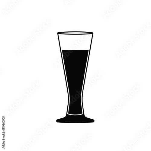 Black liquid in a tall clear glass drink