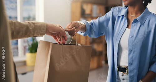 Tableau sur toile Hands, paper bag and people in boutique, employee and discount deal with purchase