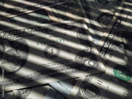 Photos The horizontal shadow of the blinds resembles the grid on dollar bills