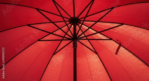 Looking up at the bright red fabric structure of an open umbrella canopy offering protection from rain and elements, pattern, geometric, underside