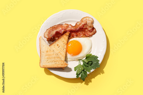 Plate with tasty fried egg,...