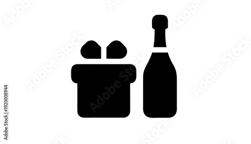 A champagne bottle and ice bucket with glasses on a luxurious table setting in a high-end event venue from a straight-on view