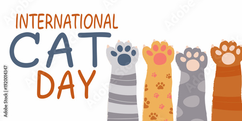 Celebrating international cat day with adorable paw prints and text