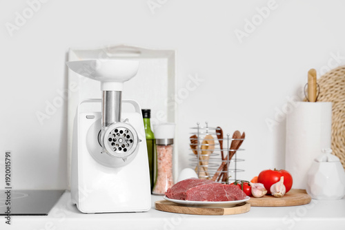 Modern meat grinder with be...
