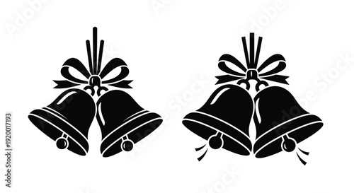 Two christmas bells with bows a striking black silhouette