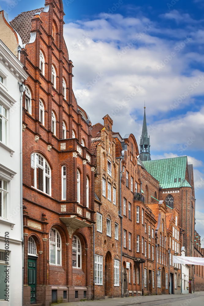 Fototapeta premium Street with historical houses in Lubeck, Germany
