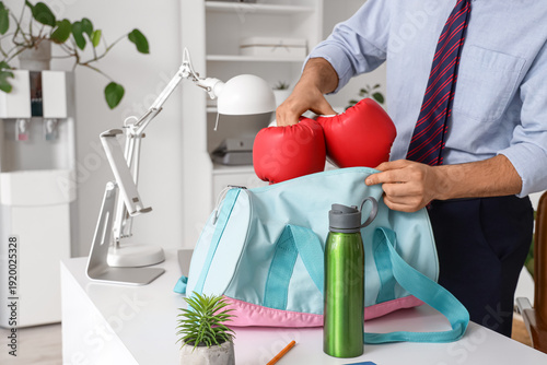 Young businessman putting b...