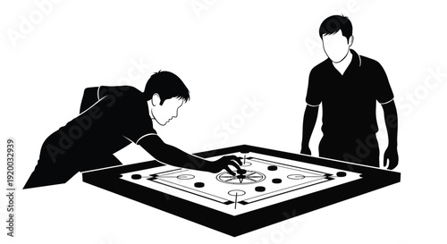 Two men playing carrom a recreational game in stark silhouette