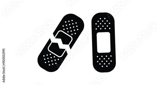 Two adhesive bandages one broken depicted in stark black silhouette