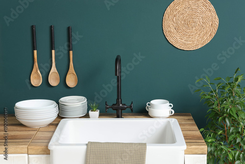 Sink and wooden table with ...