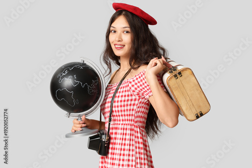 Young Asian woman with glob...