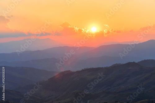 Scenic view of dramatic sky over mountain during sunset