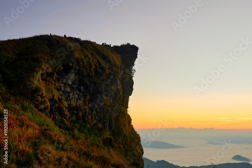 Majestic mountain against dramatic sky and morning fog