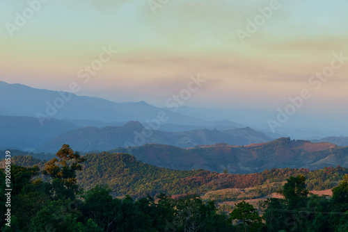 Scenic view of warm sunlight on tropical mountain during sunset